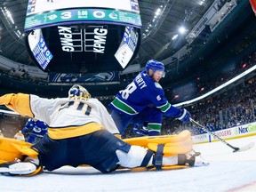 VANCOUVER, CANADA - APRIL 23: Sam Lafferty #18 of the Vancouver Canucks shoots against Juuse Saros #74 of the Nashville Predators during the second period in Game Two of the First Round of the 2024 Stanley Cup Playoffs at Rogers Arena on April 23, 2024 in Vancouver, British Columbia, Canada.