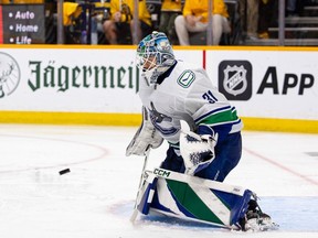 Arturs Silovs of the Vancouver Canucks makes a save against the Nashville Predators during the third period of Game Four of the First Round of the 2024 Stanley Cup Playoffs at Bridgestone Arena on April 28, 2024 in Nashville, Tennessee.