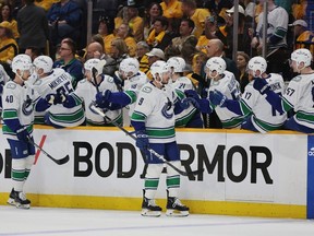 Canucks centre J.T. Miller does the celebration stroll Friday after scoring on the power play in Nashville.