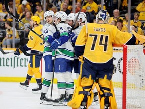 Brock Boeser and Elias Pettersson of the Vancouver Canucks celebrate after Boeser scored a goal in the second period against the Nashville Predators in game three of the First Round of the Eastern Conference NHL Stanley Cup Playoffs at Bridgestone Arena on April 26.