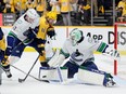 Casey DeSmith #29 of the Vancouver Canucks blocks a shot on goal in the third period of the 2-1 win against the Nashville Predators in game three of the First Round of the Eastern Conference NHL Stanley Cup Playoffs at Bridgestone Arena on April 26, 2024 in Nashville, Tennessee.