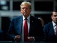 Former U.S. President Donald Trump walks out of the courtroom following the first day of jury selection at Manhattan Criminal Court in New York City on April 15, 2024.