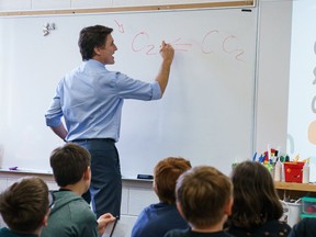 Prime Minister Justin Trudeau in front of a classroom in this photo that he uploaded to social media on April 24 with the caption "teacher mode."