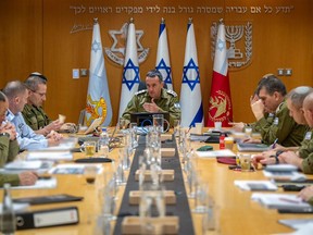 The head of Israel's military, Lieutenant General Herzi Halevi, centre, at a situational assessment with members of the General Staff Forum at the Kirya military base, which houses the Defence Ministry in Tel Aviv, on April 14, 2024.