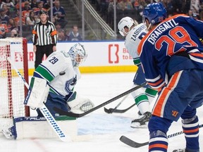 Vancouver Canucks' goalie Casey DeSmith (29) makes the save on Edmonton Oilers' Leon Draisaitl (29) during second period NHL action in Edmonton, Saturday, April 13, 2024.