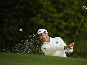 Nick Taylor, of Canada, hits from the bunker on the 10th hole during a practice round in preparation for the Masters golf tournament at Augusta National Golf Club Wednesday, April 10, 2024, in Augusta, Ga.