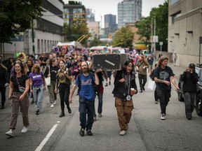 Advocates for drug users are raising concerns about British Columbia's request for Health Canada to give police the power to intervene when they see illicit drug use in public spaces, saying it may be a step backwards in the fight against the deadly opioid crisis.  Andrew Leavens, front left, and Carl Gladue, front right, carry an empty coffin during a march organized by the Vancouver Area Network of Drug Users (VANDU) to mark International Drug Awareness Day. Overdose, in Vancouver, BC, on Thursday, August 31.  2023.