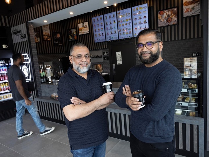  Shiraj Kothiwala and Ajmal Gundhra at the newest Chaiiwala of London cafe in Newton on Friday. Their favourite beverage is the karak chaii. “The spices taste phenomenal. It wakes you up,” said Gundhra.
