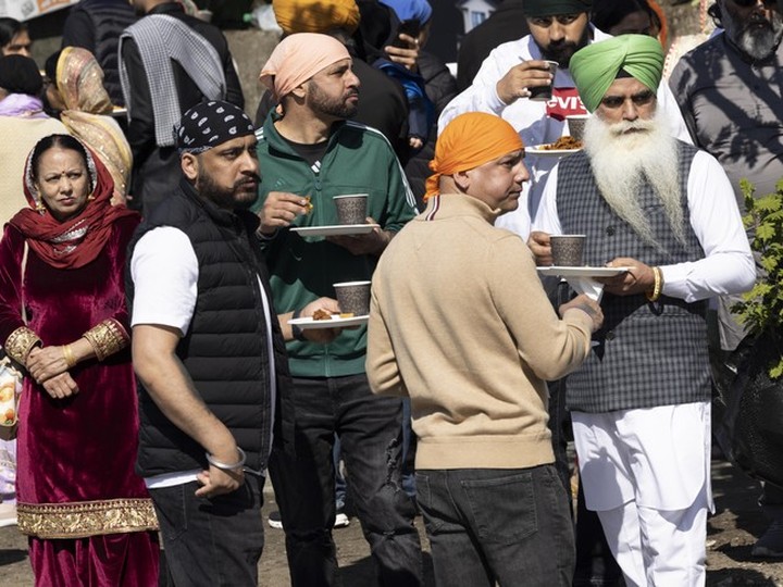  Attendees enjoy snacks during the annual Vaisakhi parade in Vancouver.