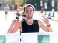 Thomas Farad from Repentigny, QC crosses the finish line to win the 2024 Vancouver Sun Run with a time of 28 min, 45 sec.