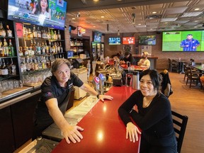 Owners Glenn Jensen and Jennifer Yates inside Legends Pub in Richmond.