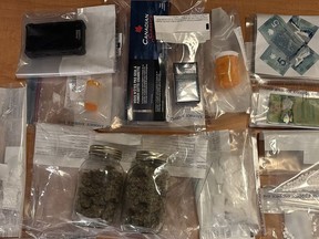 Police in Prince George, B.C., say they have arrested two people over allegations they were trafficking safe-supply drugs that are prescribed as an alternative to the toxic drug supply in the province. Items seized by the Prince George RCMP, from what it calls an alleged case of safe-supply drugs being trafficked, are seen in an undated police handout photo.