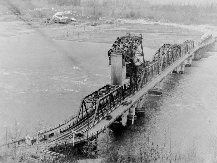  View of vehicles crossing over the first Second Narrows Bridge to North Vancouver: April 7, 1929. Vancouver Archives AM1376-F35-: CVA 709-278