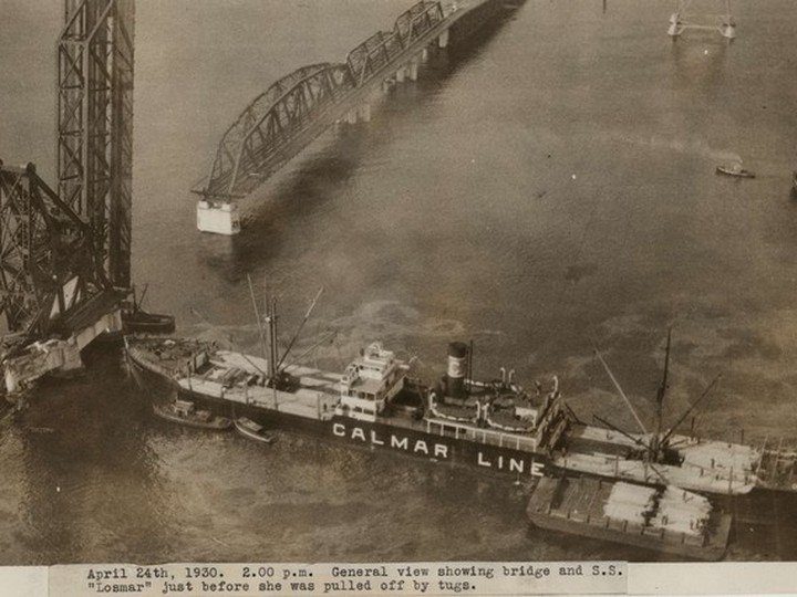  Aerial view showing the Second Narrows bridge and the SS Losmar just before she was pulled off by tugs: April 24, 1930. Vancouver Archives AM1376-F35-: CVA 709-287
