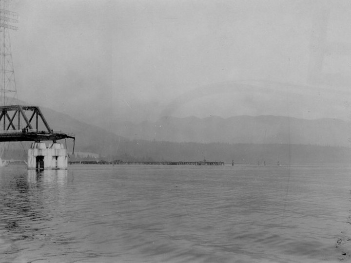  Image of missing 300-foot span on the old Second Narrows Bridge, Sept. 19, 1930. This was part of the first Second Narrows Bridge, which the hulk of the ship Pacific Gatherer crashed into on Sept. 19, 1930. Vancouver Archives AM1376-F35-: CVA 709-310