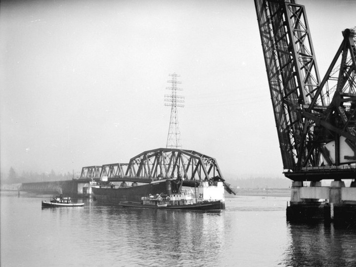  The ship Pacific Gatherer after its collision with the Second Narrows Bridge on Sept. 19, 1930. The tug Lorne is in attendance. Stuart Thomson Vancouver Archives AM1535-: CVA 99-2153
