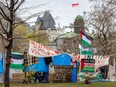 Banners, one of them reading "Intifada until victory," at an anti-Israel encampment set up on the grounds of McGill University.