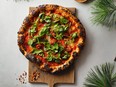 Nightingale Pizza with Cherry Tomatoes, Olives and Arugula, by chef David Hawksworth for Vancouver Eats by Joanne Sasvari, reprinted with permission from Figure 1 Publishing.