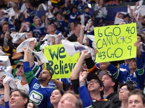 Vancouver Canucks fans cheer during the first period against the Edmonton Oilers in Game Two of the Second Round of the 2024 Stanley Cup Playoffs at Rogers Arena on May 10, 2024 in Vancouver, British Columbia.