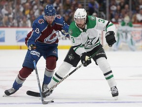 Valeri Nichushkin #13 of the Colorado Avalanche fights for control of the puck against Chris Tanev #3 of the Dallas Stars in the first period during Game Three of the Second Round of the 2024 Stanley Cup Playoffs at Ball Arena on May 11, 2024 in Denver, Colorado.