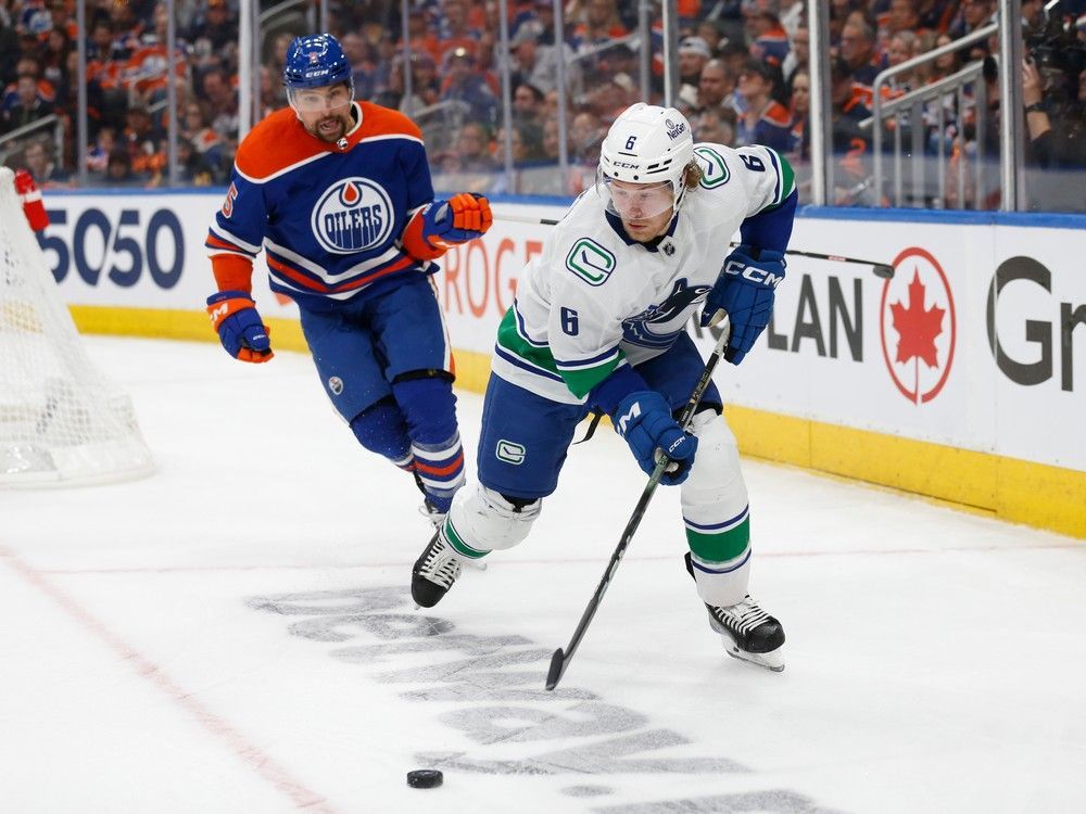 Brock Boeser skates with the puck against Cody Ceci during the third period in Game 6 on Saturday.