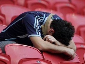An Argentina fan shows his dejection after his team lost to France at the 2018 FIFA World Cup in Russia. There's more disappointment locally with the news that Lionel Messi will not be joining his team in Vancouver.
