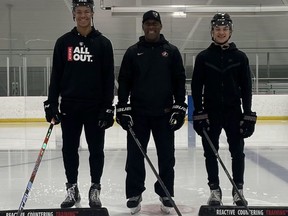 Mark Burgin stands between Cayden Lindstrom of the Medicine Hat Tigers, left, and Miles Burgin of the Surrey Eagles. When Lindstrom, the third-ranked 2024 eligible skater on the NHL Central Scouting's list arrived in town for Team BC tryouts when he was 15, but didn't have a place to stay. The Burgin family welcomed him to stay ... and he stayed for the next three years.