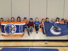 The kindergarten class of Irma School, located in the town of Irma, Alberta. The class is showing their support for both the Vancouver Canucks and the Edmonton Oilers, as former student and current Vancouver Canucks defenceman Carson Soucy plays in in the 2024 NHL Playoffs.