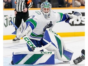 Vancouver Canucks goaltender Arturs Silovs (31) blocks a shot on goal against the Nashville Predators during the second period in Game 4 of an NHL hockey Stanley Cup first-round playoff series Sunday, April 28, 2024, in Nashville, Tenn.