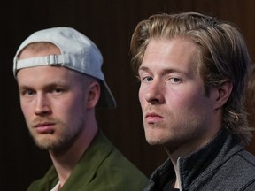 Vancouver Canucks' Brock Boeser and Elias Pettersson, listen during the NHL hockey team's end of season news conference, in Vancouver, B.C., Thursday, May 23, 2024.