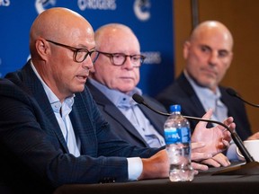 Vancouver Canucks GM Patrik Allvin (from left), president Jim Rutherford and head coach Rick Tocchet speak ahead of training camp, at the Park Vancouver September 20, 2023.