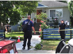 IHIT officers at the location of a home invasion