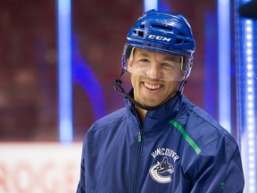 Vancouver Canucks assistant coach Manny Malhotra smiles during practice at Rogers Arena in Vancouver, BC, Oct. 2, 2018.