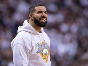 FILE: Drake watches the Toronto Raptors play the Philadelphia 76ers during NBA playoff action in Toronto, Tuesday, May 7, 2019.