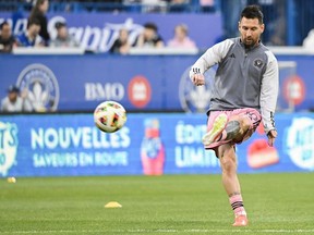 Inter Miami's Lionel Messi plays the ball during the warm up at Stade Saputo ahead of an MLS soccer game against CF Montreal in Montreal, Saturday, May 11, 2024.
