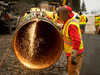 A welder works on a section of pipeline for the Trans Mountain expansion project. The completed pipeline was given the OK to begin commercial operations on May 1, 2024.