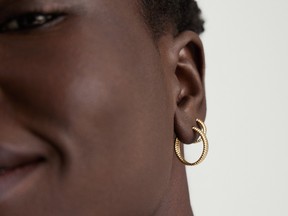 The Mejuri Salmon Gold Hoops are available in four sizes.