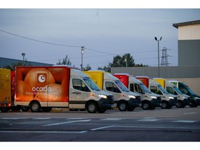 Grocery delivery trucks at a fulfillment centre, operated by Ocado Group Plc, in Enfield, U.K., on Wednesday, Sept. 30, 2020. Covid-19 lockdown enabled online and app-based grocery delivery service providers to make inroads with customers they had previously struggled to recruit, according the Consumer Radar report by BloombergNEF. Photographer: Hollie Adams/Bloomberg
