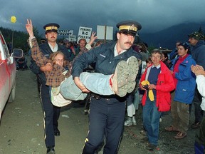 An anti-logging protestor is carried away by RCMP after being arrested for blocking logging trucks at the entrance to Clayoquot Valley, B.C., on July 30, 1993. Forests that were part of environmental and Indigenous rights battlegrounds during British Columbia's 'War in the Woods' over clear-cut logging during the1980s and 1990s will receive permanent protections in Clayoquot Sound.