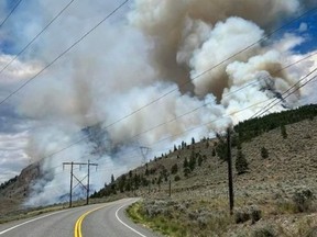 A highly visible wildfire near Lillooet, B.C., is billowing smoke above Highway 99