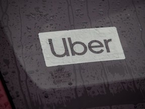 An Uber driver's vehicle is seen after the company launched service, in Vancouver, Friday, Jan. 24, 2020. Uber says changes coming to the laws surrounding British Columbia ride-share and delivery workers will drive up costs and reduce demands for local restaurants.