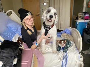 Handout photo of Samantha O'Neill, who died days before her 35th birthday, in hospital with her dog, Jack, and a friend's dog, Bella