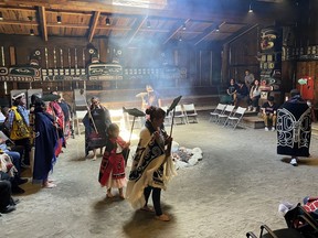 Indigenous dancers perform the Salmon Dance on Indigenous Peoples Day at the Mungo Martin House in Thunderbird Park, in Victoria, Friday, June 21, 2024.
