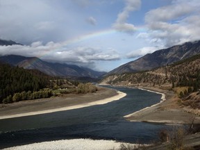Environment Canada says an unseasonable cool air mass over southern B.C. has broken minimum temperature records, including one dating back about 70 years. A rainbow can been seen over where the Fraser and Thompson rivers meet in Lytton, B.C., Wednesday, Oct. 18, 2023.
