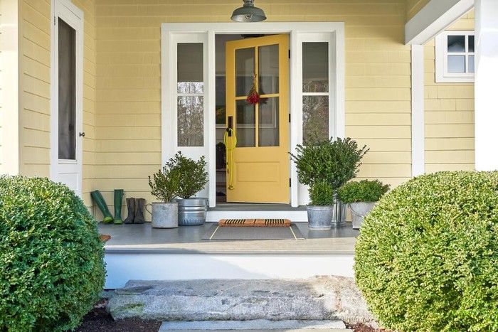 Front door painted in Benjamin Moore's Stuart Gold.