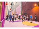 People playing basketball in Alley Oop during an activation event.