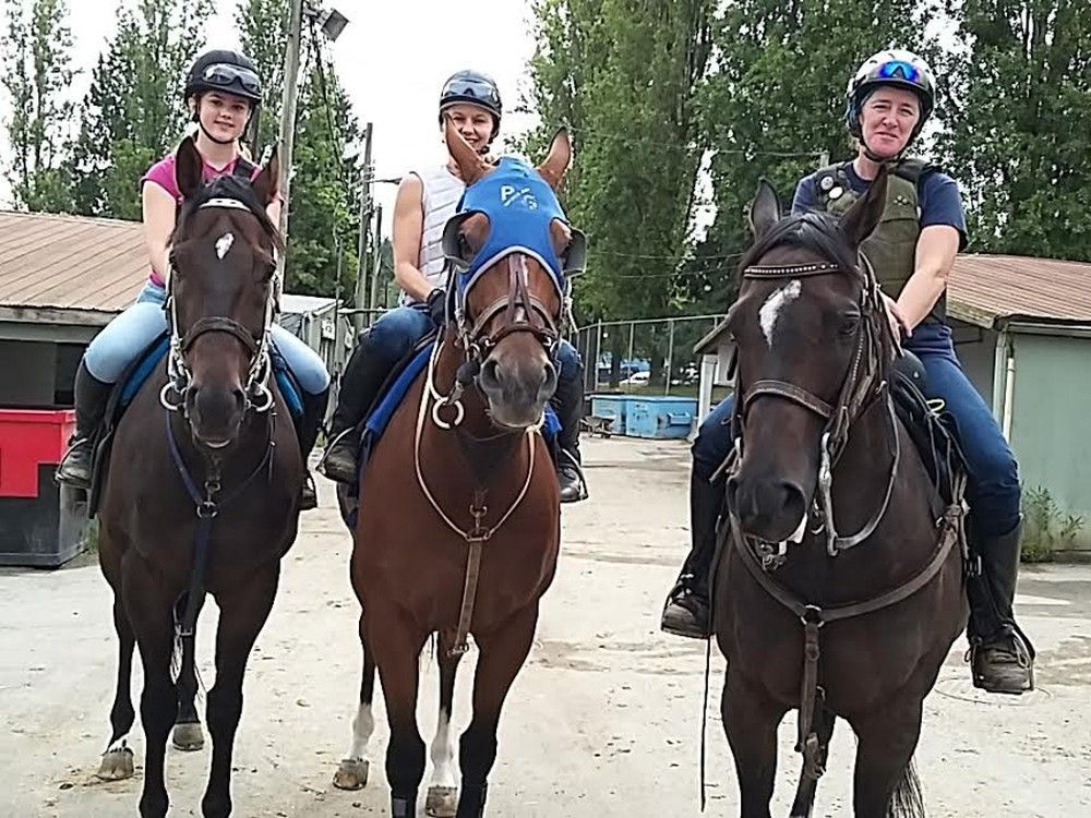 Hastings trainer Patty Leaney with daughter Jaymie and pony person Cindy Barroby on their way to the racetrack.