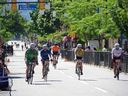 Riders reach the finish line of Sunday's 12th annual Okanagan Granfondo on Main Street in Penticton. Photo: Barb Aguiar