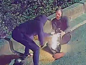 Police in Metro Vancouver say they're looking for a suspect whose pants caught fire in an alleged arson attempt in April, shown in an RCMP handout image. Richmond RCMP shared a photo of two suspects showing one man whose pant leg is ablaze and another trying to help him put out the flames.