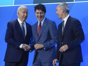 President Joe Biden and NATO Secretary General Jens Stoltenberg, right, welcome Prime Minister Justin Trudeau to the NATO Summit, Wednesday, July 10, 2024, in Washington. The Canadian and U.S. governments say they have reached an agreement-in-principle in the process to modernize the Columbia River Treaty, which regulates the waterway that flows from southeastern British Columbia into Washington state.